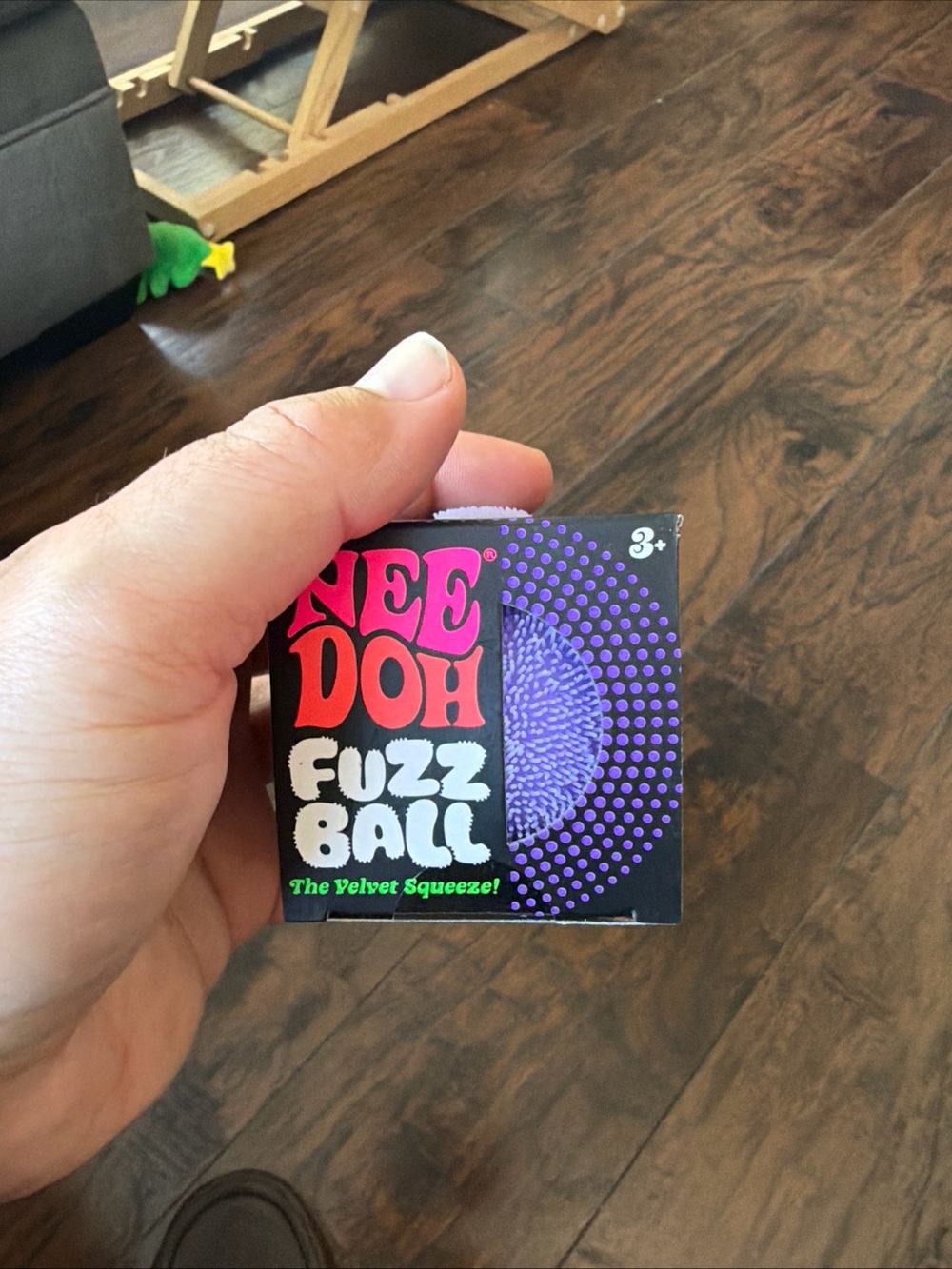 Squeeze NeeDoh Fuzz Ball Purple and Black Toy